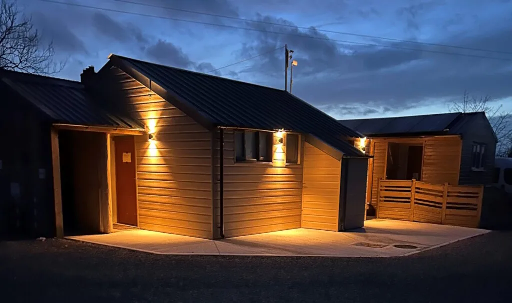 Hungerford Farm Touring Caravan Park toilet block in the evening